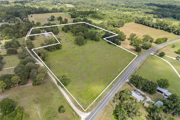 a view of a swimming pool and an outdoor space