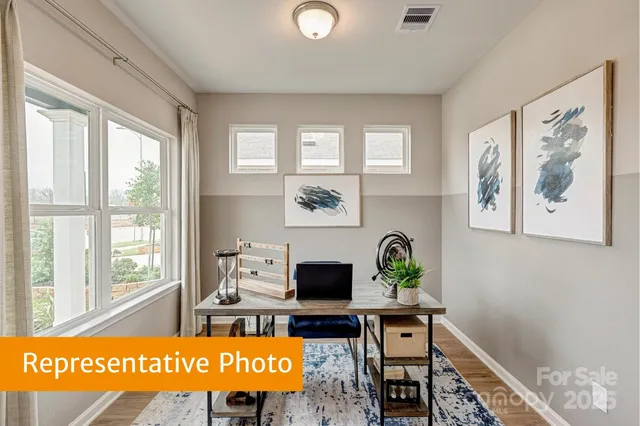 a view of a workspace with furniture