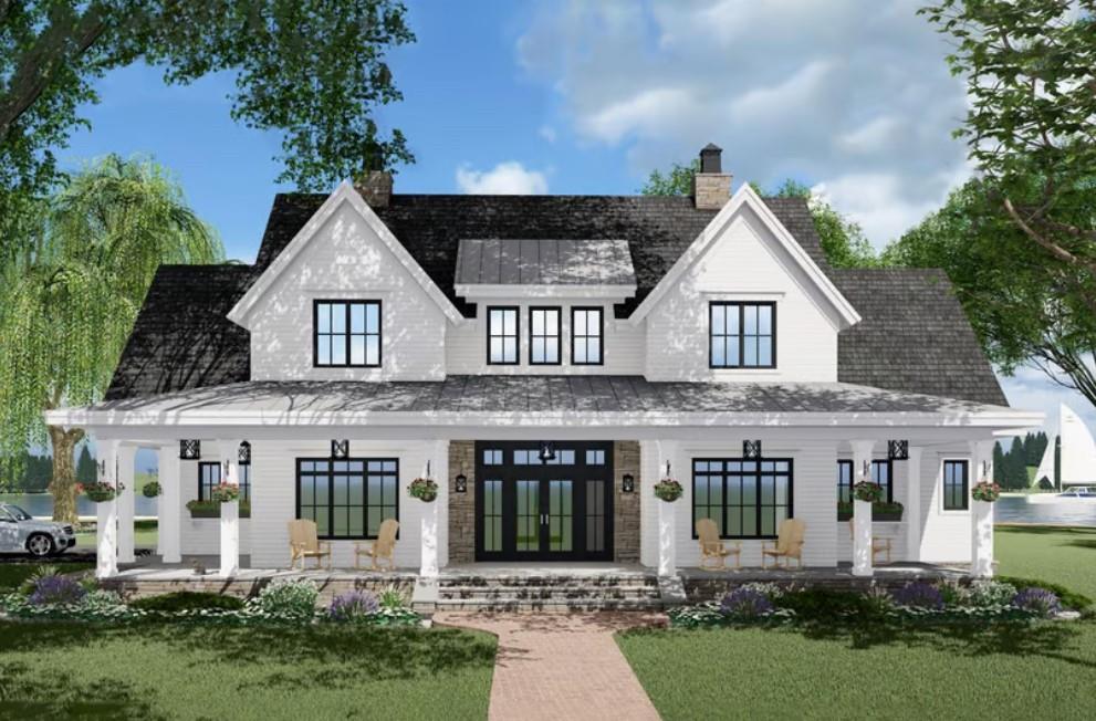 a front view of white house with a yard