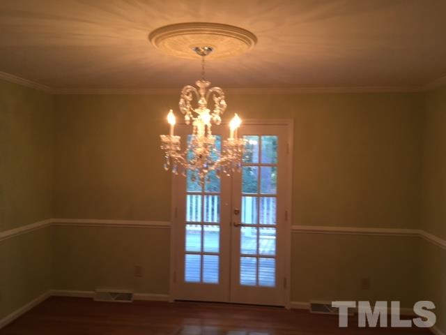 3732 Lassiter Mill Road Raleigh, NC 27609 - Photo 3 of 11 a view of a chandelier and wooden floor in a room