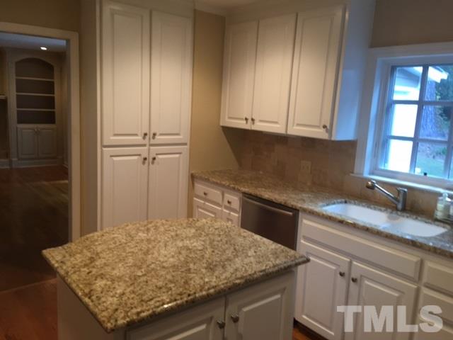 3732 Lassiter Mill Road Raleigh, NC 27609 - Photo 4 of 11 a kitchen with granite countertop cabinets and window