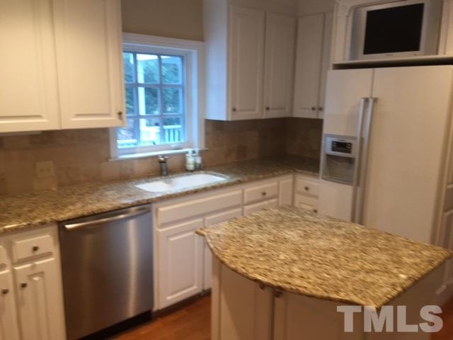3732 Lassiter Mill Road Raleigh, NC 27609 - Photo 5 of 11 a kitchen with granite countertop sink cabinets and stainless steel appliances
