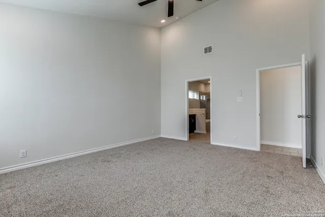 a spacious bathroom with a double vanity sink a and a mirror