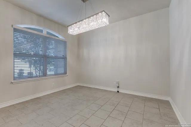 a kitchen with stainless steel appliances granite countertop a refrigerator a stove top oven a sink and dishwasher