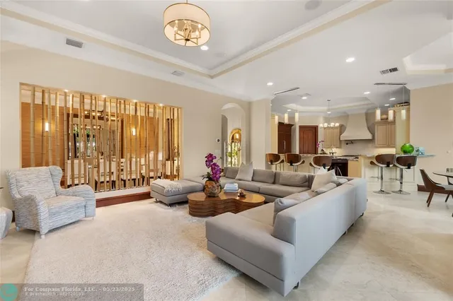 a kitchen with stainless steel appliances kitchen island granite countertop a refrigerator and a stove top oven