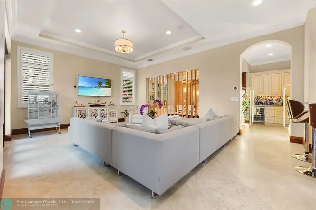a kitchen with kitchen island granite countertop a sink a counter top space appliances and cabinets