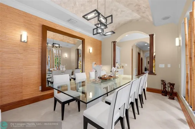 a kitchen with white cabinets and appliances