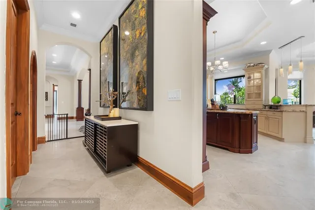 a open kitchen with stainless steel appliances kitchen island granite countertop a table and chairs in it