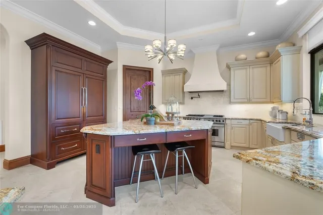 a spacious bedroom with a bed couch and window