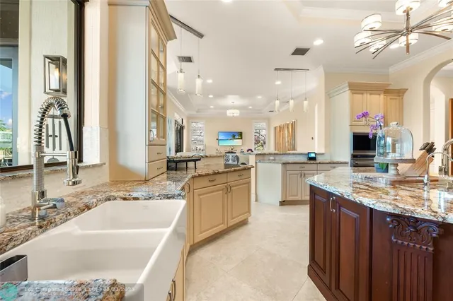 a spacious bathroom with a granite countertop tub a sink and a window