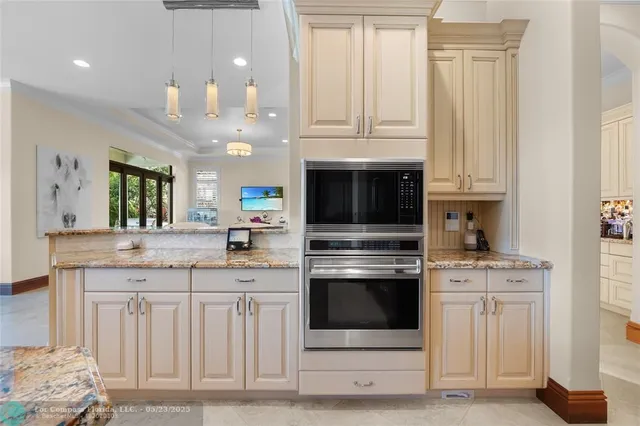 a bathroom with a granite countertop toilet a sink and a mirror