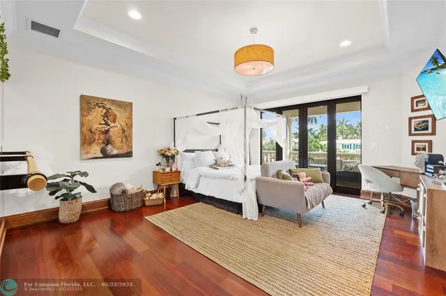 a view of a chairs and table in patio with a lake view