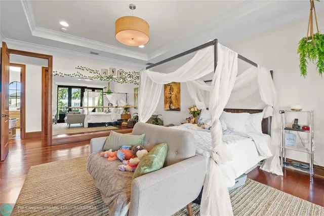 a living room with a fireplace and potted plant
