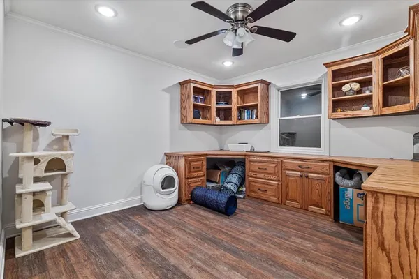 a spacious bathroom with a tub sink and mirror
