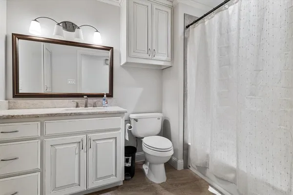 a view of walk in closet with clothes