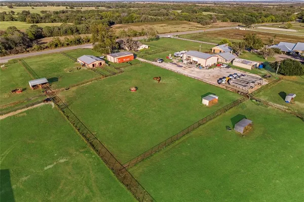 a view of a room with wooden walls and windows