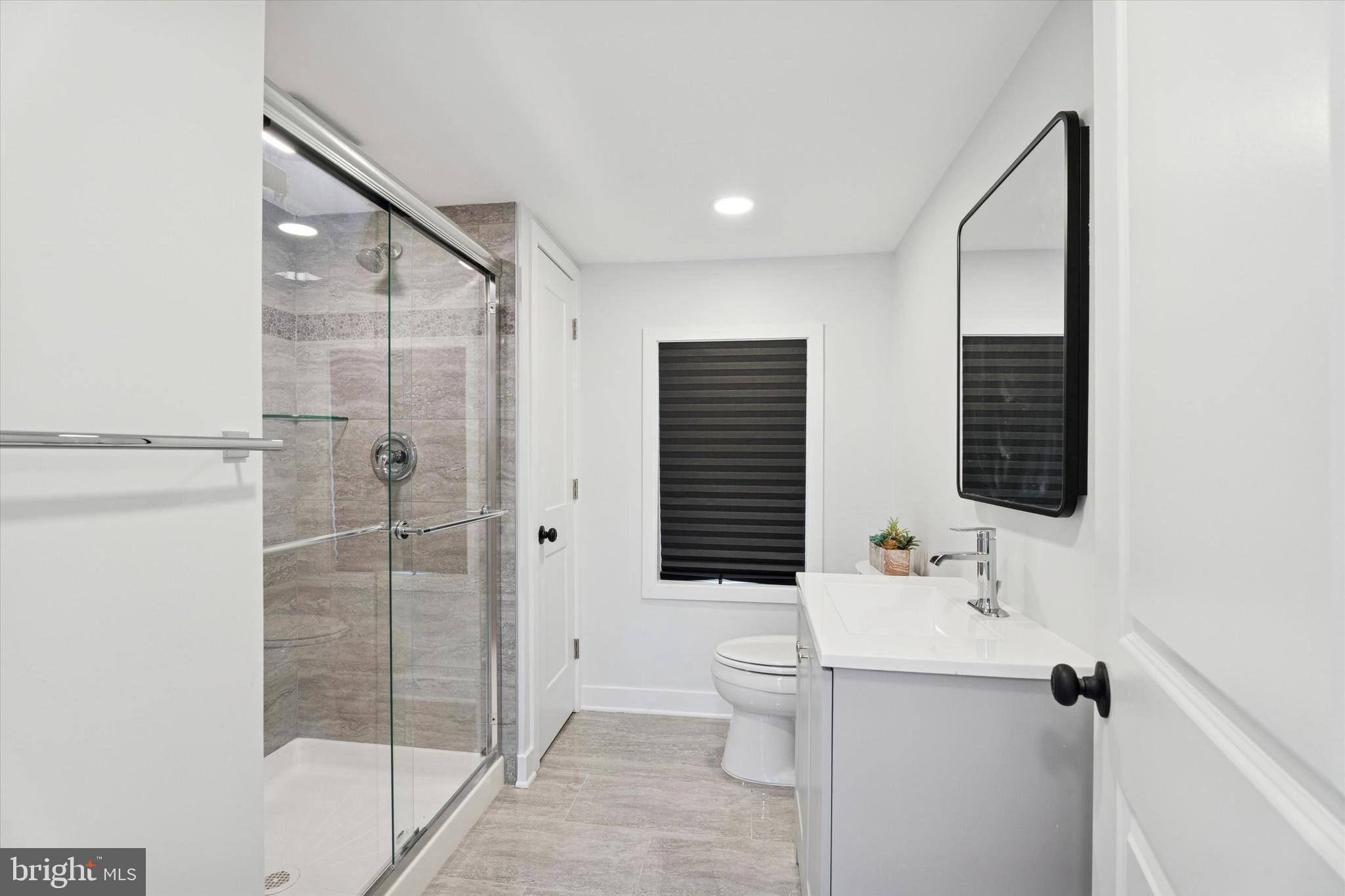 841 Cypress Ave Spring Spring City, PA 19475 - Photo 13 of 18 a bathroom with a sink toilet and shower