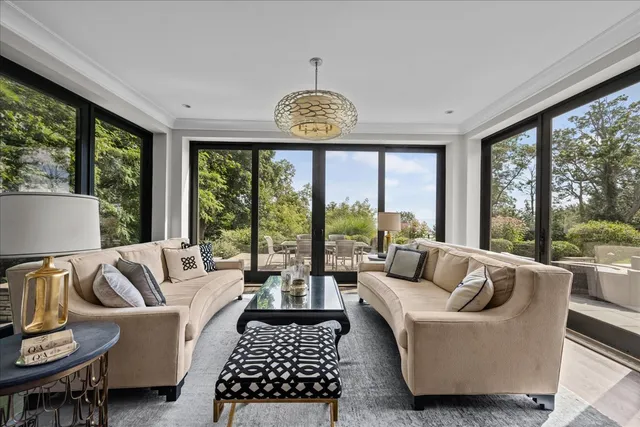 a kitchen with stainless steel appliances white cabinets and wooden floor