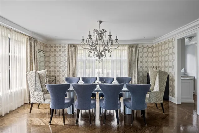 a large kitchen with kitchen island a large counter space a sink appliances and cabinets