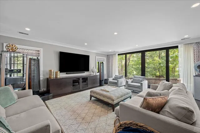 a bath tub sitting in a bathroom next to a large window