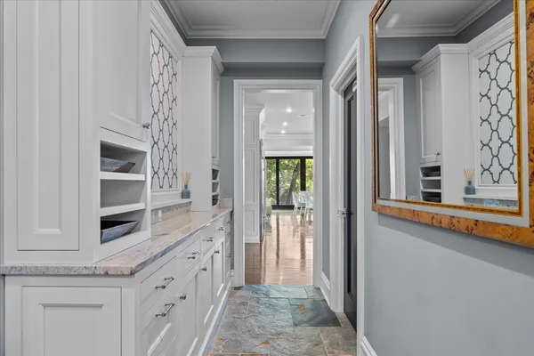 a spacious bathroom with a tub sink and mirror