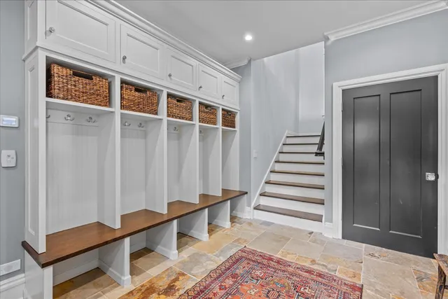 a bedroom with a large bed and a large window