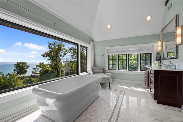 a bathroom with a sink vanity and a mirror