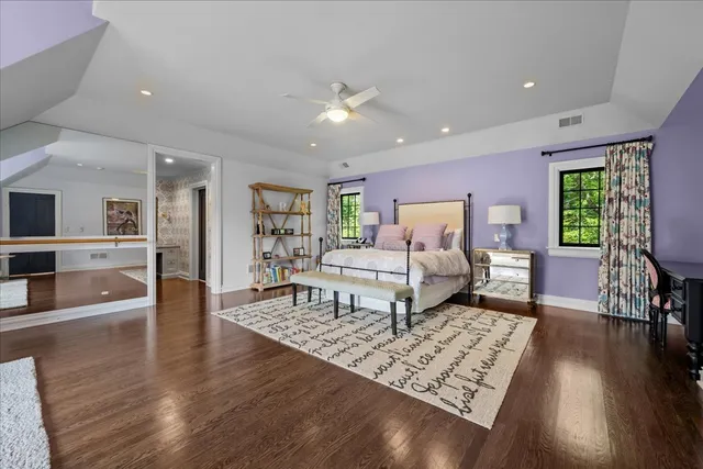 a view of a patio with dining table and chairs with potted plants and big yard
