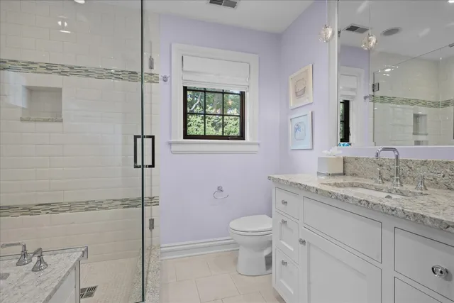 a view of a backyard with plants and a garden