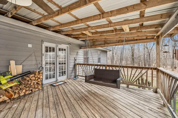 a view of a house with a yard and sitting area