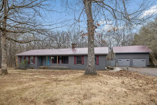 a front view of a house with garage