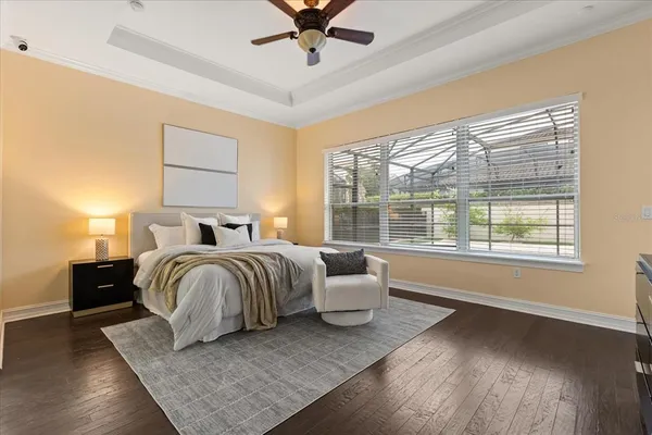 a bedroom with a bed dresser and a window