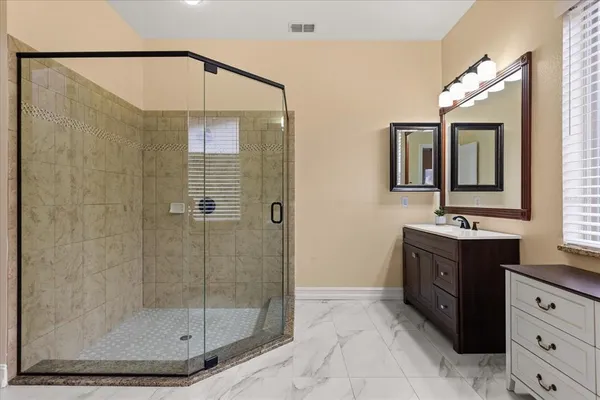 a bathroom with a glass shower