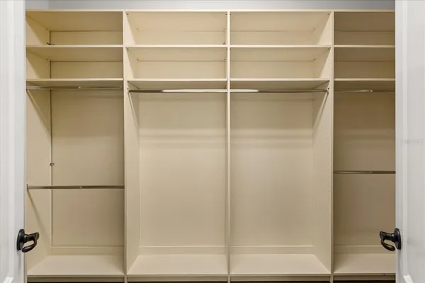 a view of empty room with a large window