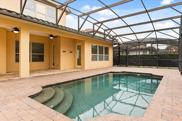 a view of a swimming pool with a patio