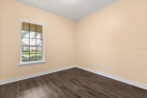a bathroom with a sink a toilet a mirror and bathtub