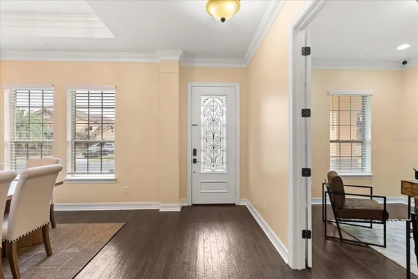 a dining room with furniture and window