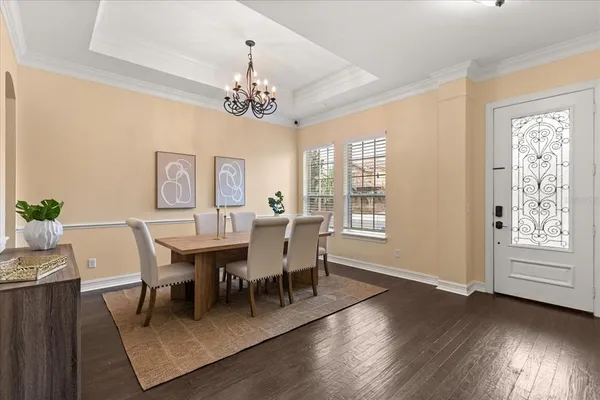 a living room with furniture and kitchen view