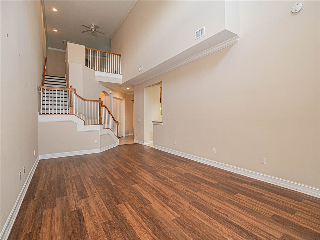 1875 Bridgepointe Circle, Unit 33 Vero Beach, FL 32967 - Photo 7 of 33 wooden floor in an empty room