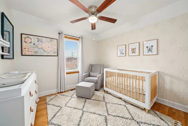 a bedroom with a bed and a rug