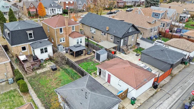 an aerial view of residential houses with outdoor space