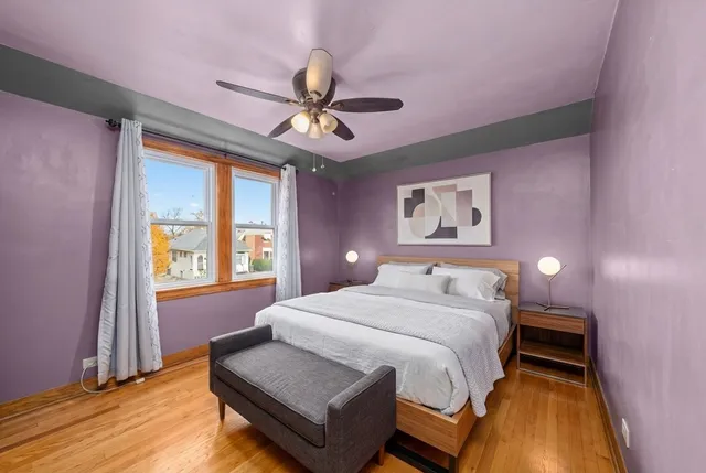 a bedroom with a bed and window