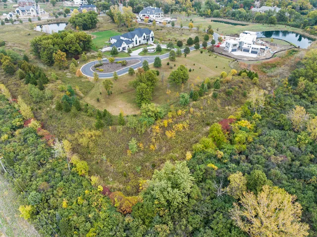 an aerial view of residential house with outdoor space