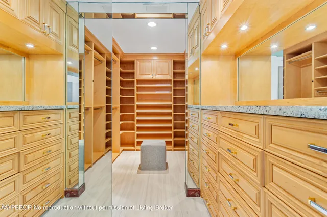 a bathroom with a double vanity sink and large mirror
