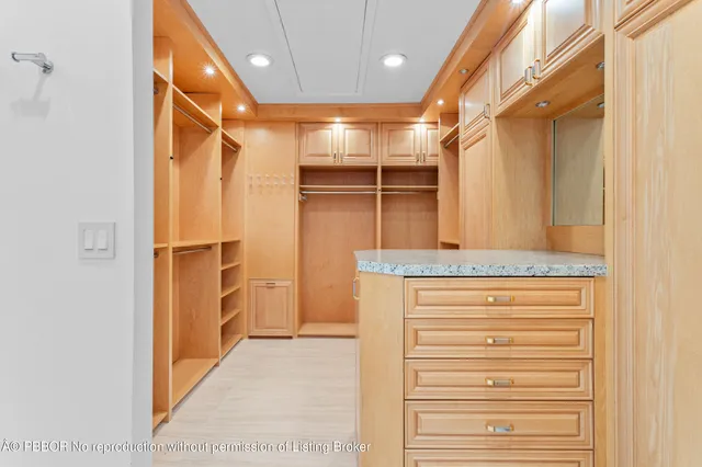 a bathroom with a double vanity sink a toilet and a mirror