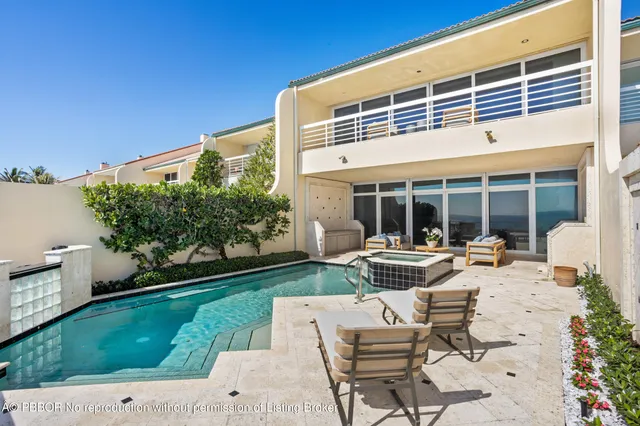 a view of a house with backyard sitting area and garden