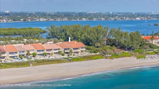 an aerial view of residential house with outdoor space and lake view