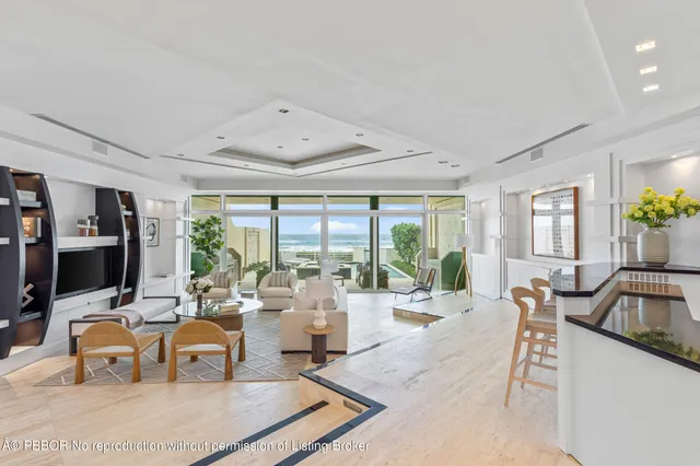 a living room with furniture large window and flat screen tv