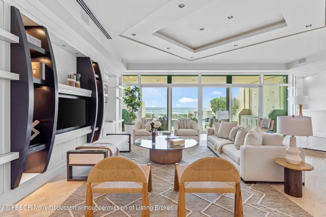 a living room with fireplace furniture and a flat screen tv