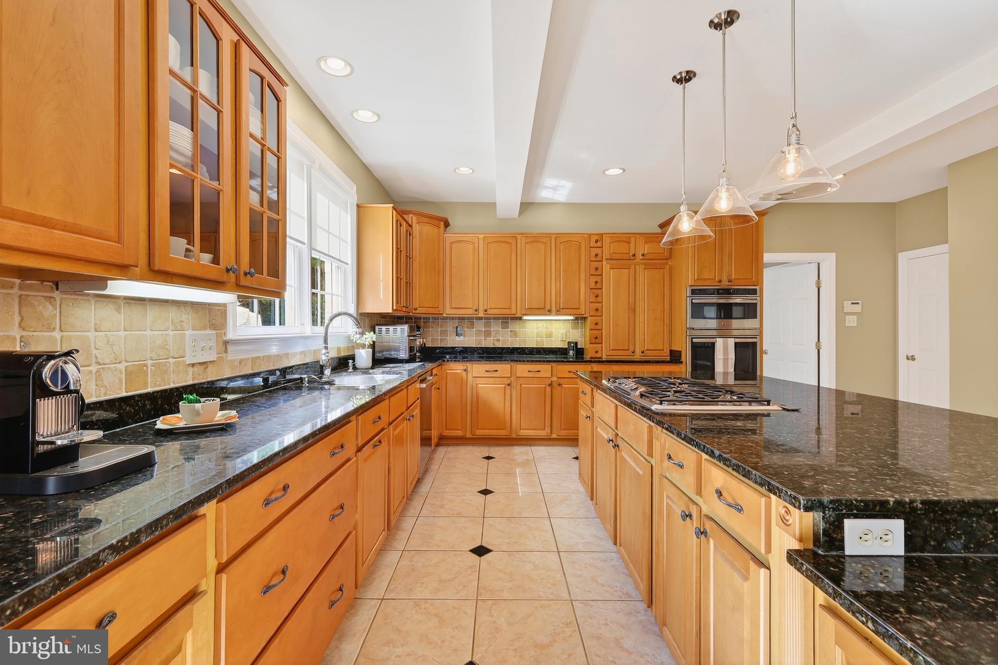 7221 Preservation Court Fulton, MD 20759 - Photo 22 of 69 a large kitchen with stainless steel appliances granite countertop a sink and counter space